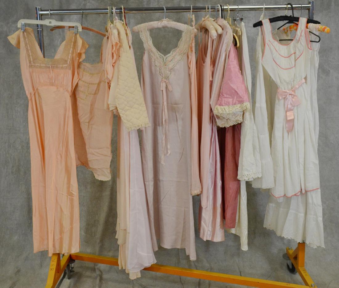 (24) Piece Vintage Lingerie Grouping: (24) piece vintage grouping to include silk slips, rompers, cotton petticoat, (7) vintage silk and quilted bed coats and several lace examples. Items date 30's-70s