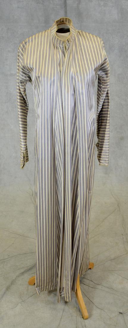 Antique Turkish Striped Silk Robe: Oyster and blue striped silk robe with knotted buttons at wrist and neck. Partially lined in linen with standing collar. open seam for about 4" at the right armpit, slight overall discoloration that c