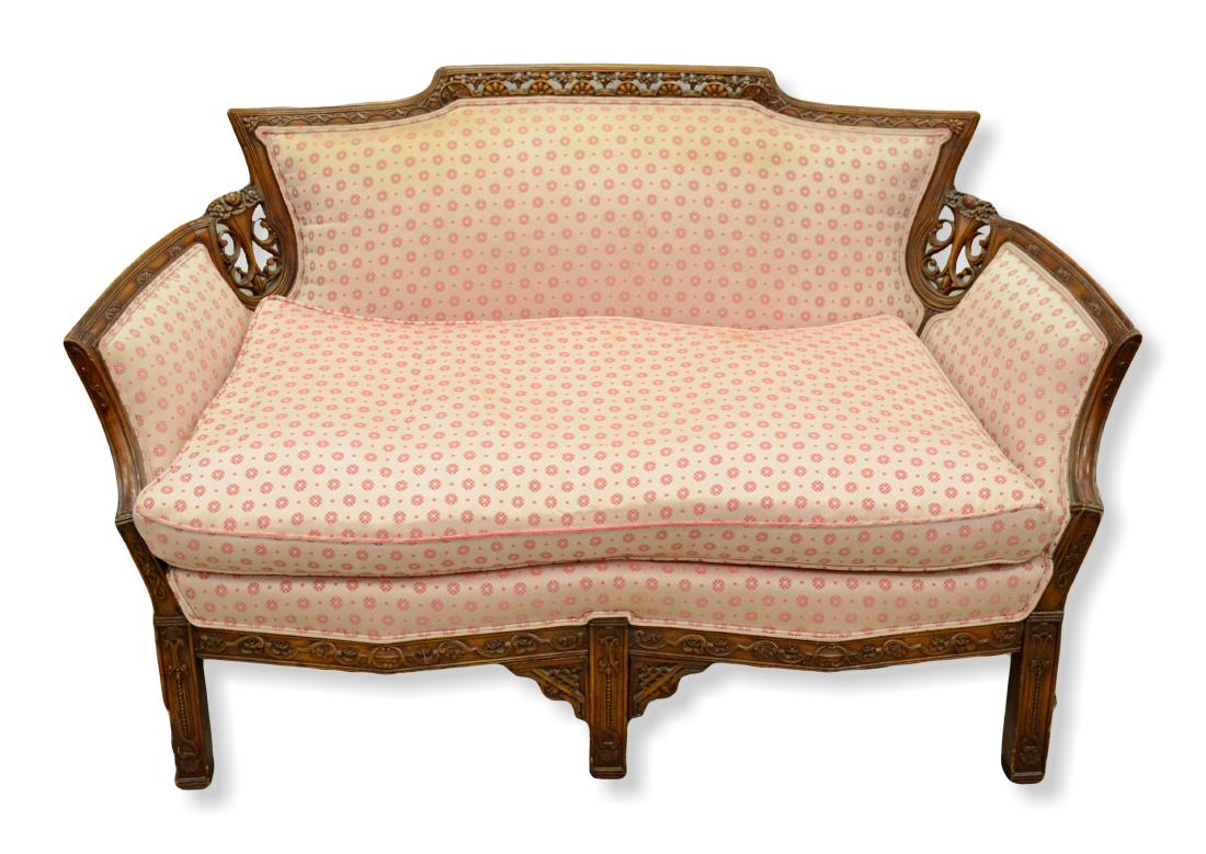 Carved walnut French style settee: Carved walnut French style settee, fan and foliate pierce carved crest, the back flanked by carved cornucopia, carved arms down to a double serpentine front rail over square carved 3 leg base, early 2