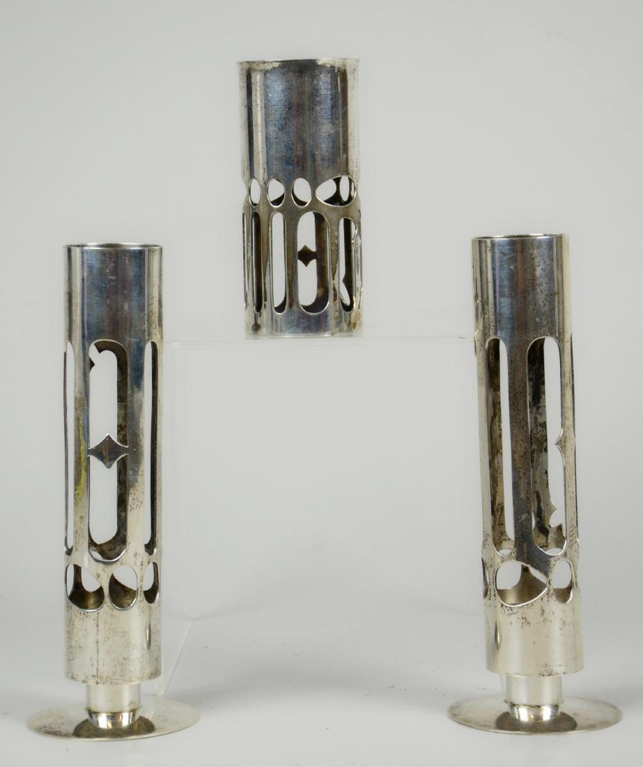 (3) Moshe Zabari Sterling Sabbath Candlesticks: (3) Moshe Zabari sterling silver contemporary Judaica candlesticks, marked "Tobe Pascher Workshop / Jewish Museum / M Zabari / Sterling", tallest 7-1/8", 19.245 TO, c 1970. An identical set is in The 