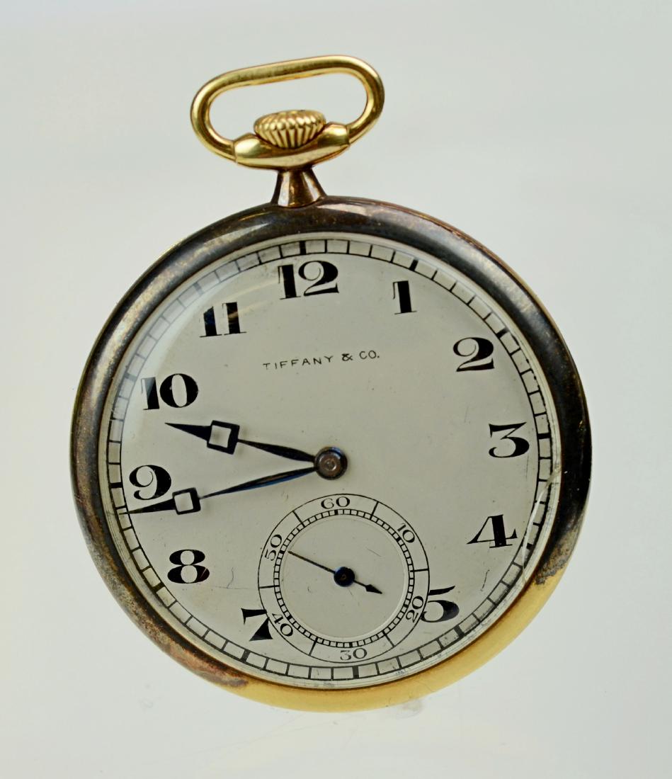 Longines / Tiffany & Co 18K YG OF Pocket Watch, 17j: Longines / Tiffany & Co 18K YG OF Pocket Watch, 42 mm case, 17j Swiss movement, SN3866692, 5 adj, presentation engraving on cuvette, silvered dial marked Tiffany & Co, 51.9 grams total weight, black A