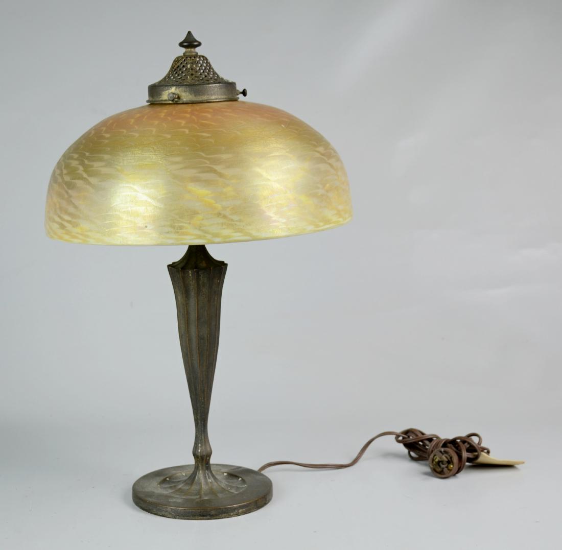 Tiffany Studios Favrile Table Lamp: Tiffany Studios, New York, bronze & favrile glass table lamp, base marked "Tiffany Studios, NY, 617", shade marked "LCT Favrile", 12" dia x 5-1/4" h, 3 small chips around fitter rim, lamp 18-1/2" h, s