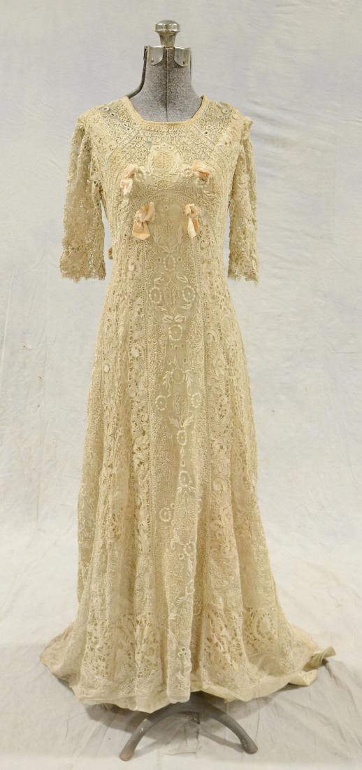 Edwardian Irish Crochet and Soutache on Net Gown: Edwardian full length gown with extended train. Silk lined body with hook and eye closures at back and ribbed waist. 3/4 length sleeves, embroidery on net, soutache on net and Irish lace comprise the 