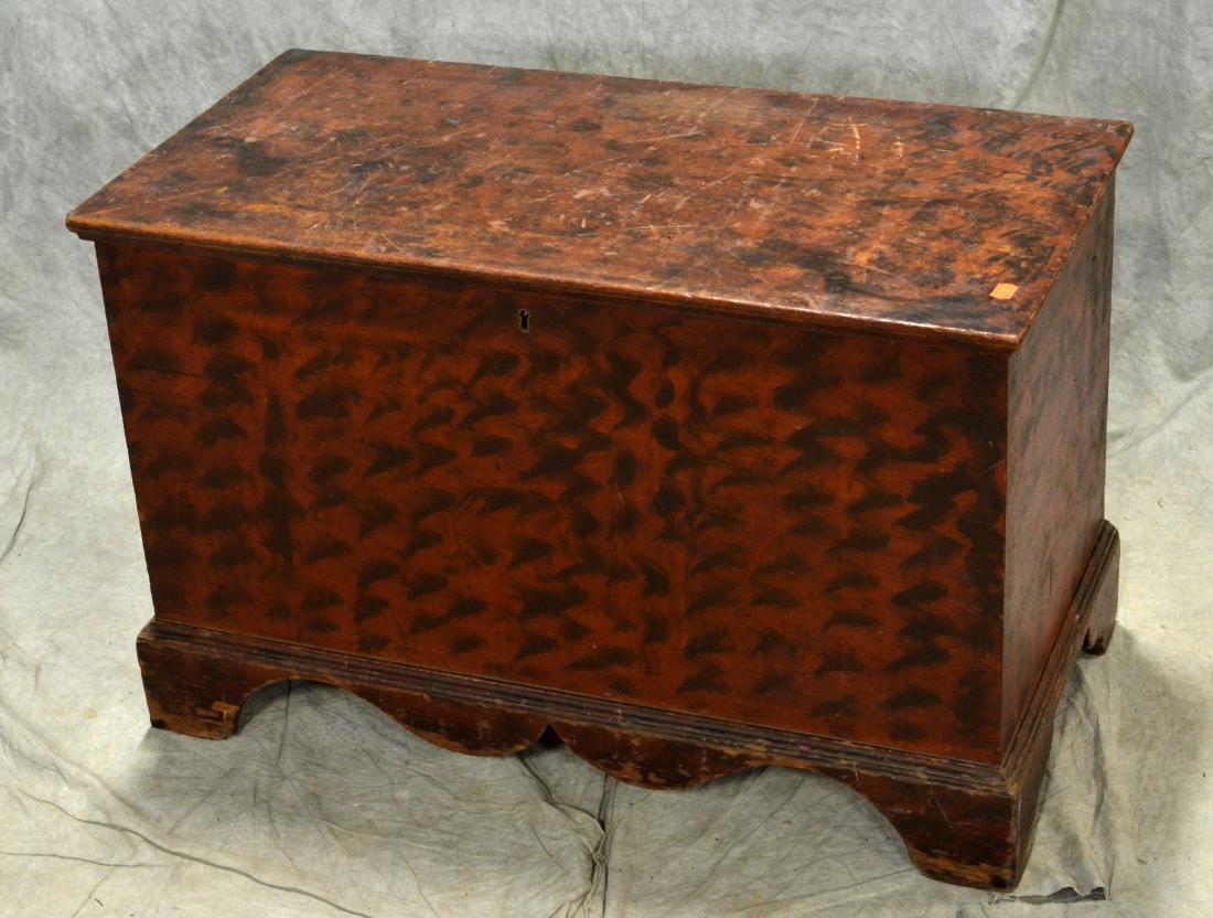 Pine paint decorated blanket chest: Pine paint decorated blanket chest, bracket feet, original red and black decoration, interior with a till, with hidden compartment, early 19th c, 32-1/2"w x 21-3/4"h x 17"d