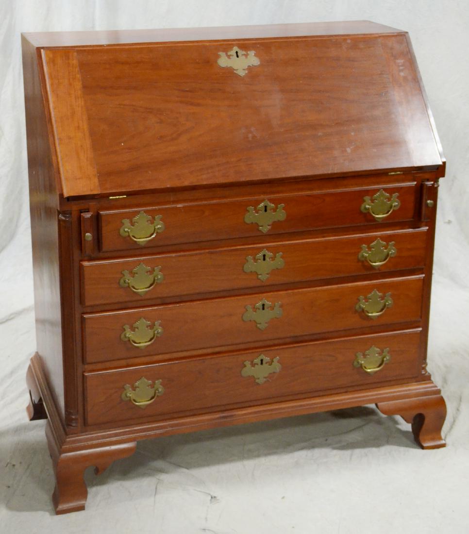 Cherry Chippendale style slant front desk: Cherry Chippendale style slant front desk, bench-made, dovetailed top, drop front with fitted interior, over (3) drawers, brass batwing hardware, fluted columns, OG bracket feet, 42"h x 38"w x 20"d