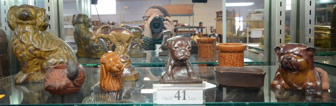 Shelf #41 - 5 Sewer Tile Animals: Shelf #41 - (5) Pcs of sewer tile animals: Spaniel, goat, (2) Bulldogs, lion, small promotional piece from Uhrichsville, OH, 1950 Clay Week, clay match holder and small pot with mouse