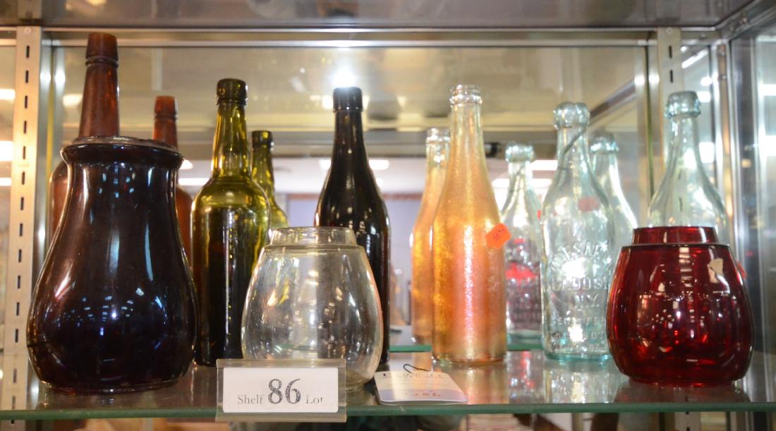 Shelf #86 - Lot of Bottle and Railroad Shades: Shelf #86 - Lot of Bottles Including Amber Ellenville Glass Works, Carnival Glass Canada Dry, R. Desareo, and Railroad Lantern Shades, Including Dietz