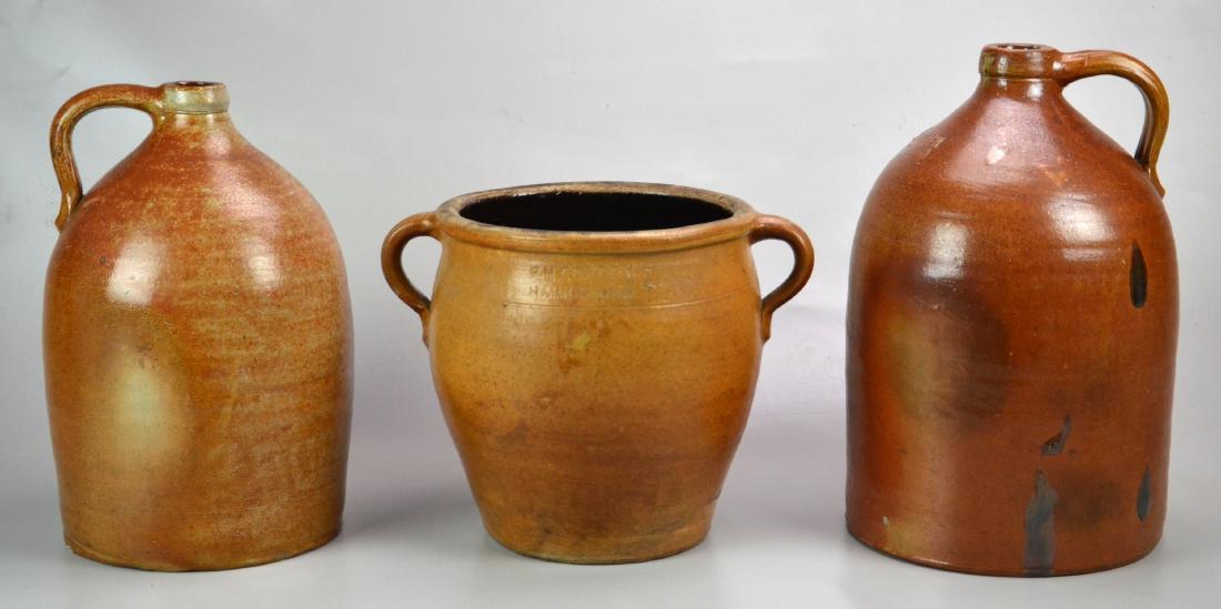 (3) Cowden Stoneware Jugs and Crock: (1) 2 Gallon FH Cowden Two Handled Crock (13-1/2" dia with handles x 9-3/4" dia without handles x 10" h), (1) JW Cowden Jug, (8-1/4" dia x 13-1/2" h), (Firing Imperfections to Surface), (Chips on Base