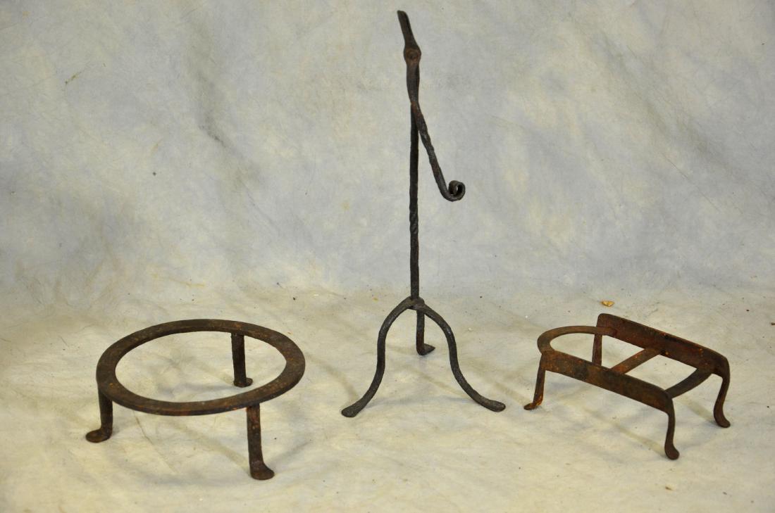 (1) Rush Light Candle Holder (2) Cast Iron Trivets: (1) Wrought Iron Rush Light Candle Holder (6-3/4" dia x 13-1/2" h), (2) Cast Iron Trivets