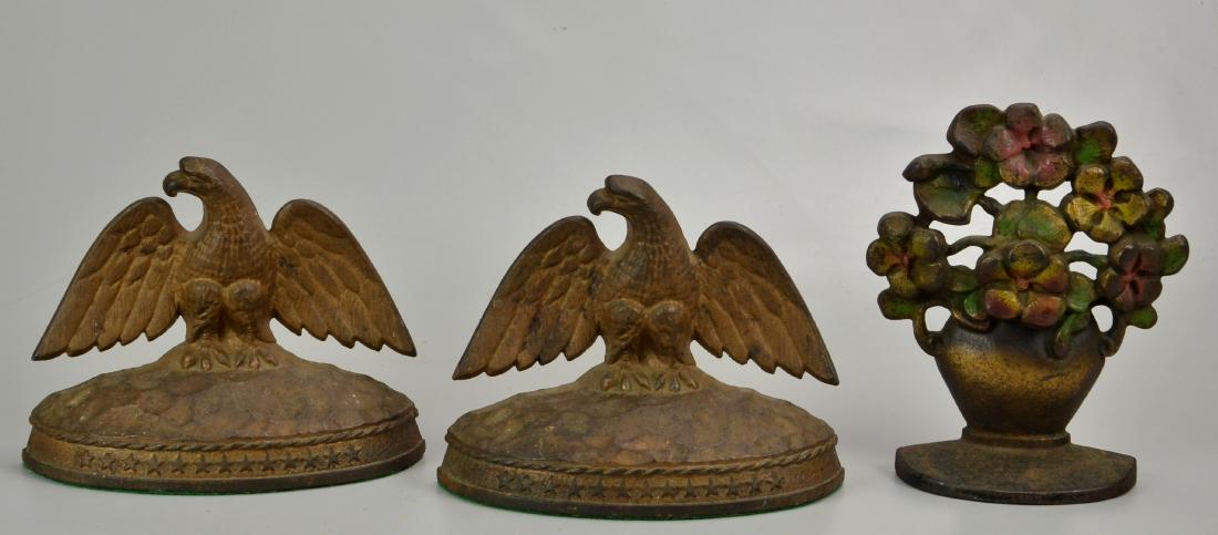 Eagle Bookends and Floral Doorstop: Pair of Hamilton Foundry Inc Eagle Bookends (7-3/4" w x 6-1/4" h), Cast Iron Floral Doorstop (6" w x 7-1/4" h)