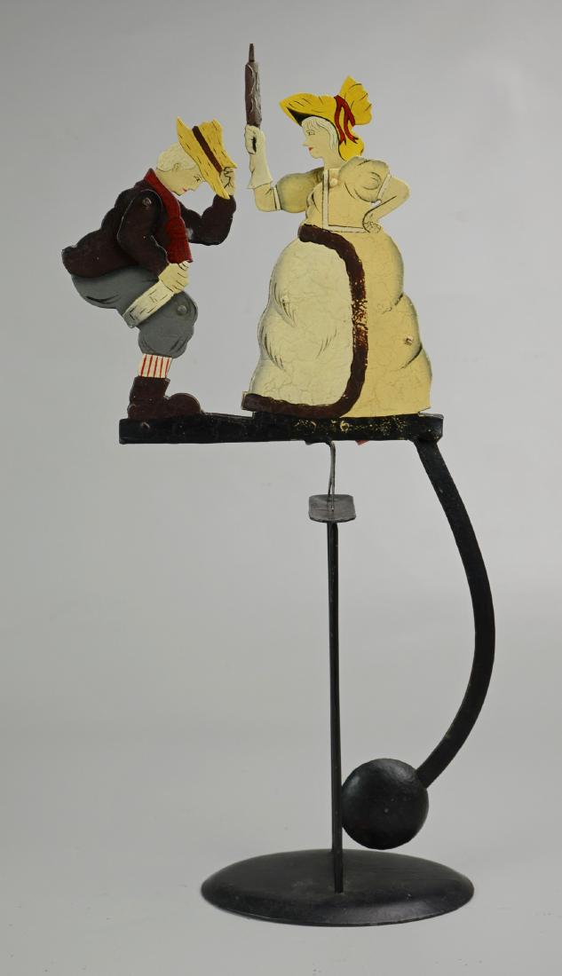 Vintage Kinetic Balance Toy: Vintage kinetic balance toy, painted wrought iron, woman with rolling pin, man with bottle, 20-1/2" h