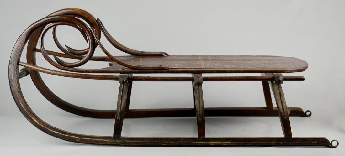 Bent & Turned Wood Child's Sled: Bent & turned wood child's sled, painted top, 33" l x 14" w, wear to paint, split in bed, damage to edges
