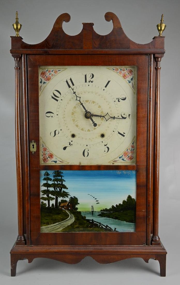 Mahogany pillar and scroll clock: Mahogany pillar and scroll clock, Label Bishop and Bradley Watertown CT, with weights and pendulum, repairs to crest, finial needs to be reset,