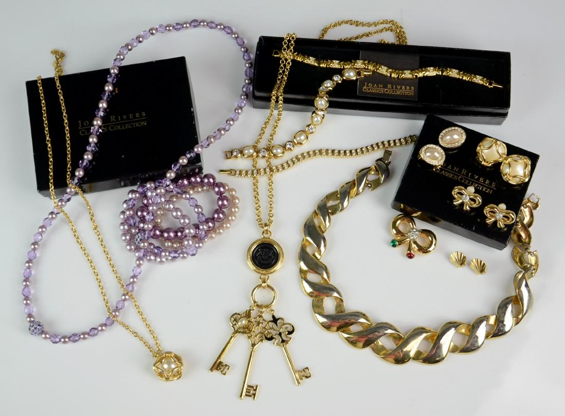 Lot of Costume Jewelry: Lot of costume jewelry, including (3) Joan Rivers bracelets, Joan Rivers bow pin & earrings set, Joan Rivers faux pearl necklace & earrings set, bead & rhinestone necklace & bracelet set, (3) bead bra
