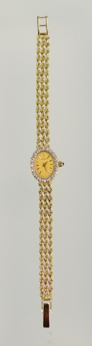 Seiko 14K YG ladies watch, diamond surrounded dial: Seiko 14K YG ladies watch, diamond surrounded dial, 6 3/8" l, total weight incl quartz movement 9.4 dwt