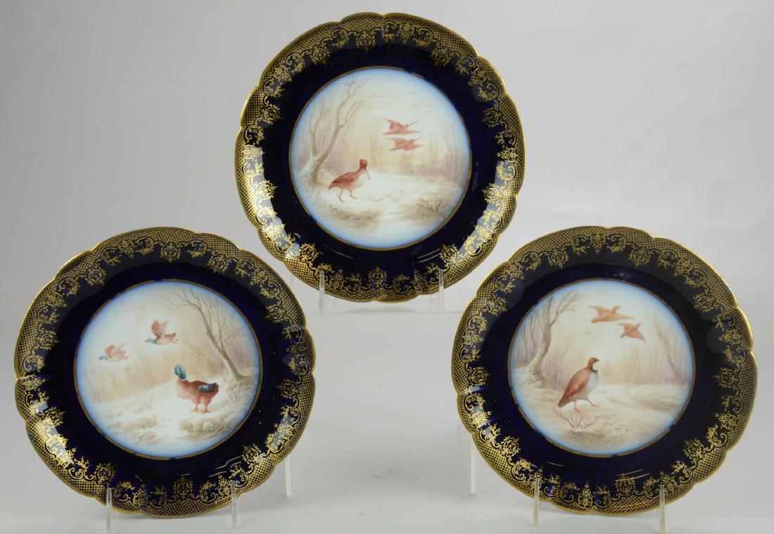 (3) M Redon Limoges Game Plates: (3) M Redon Limoges porcelain plates, cobalt blue & gold rim with hand painted pictures of wild birds, 8-7/8" dia