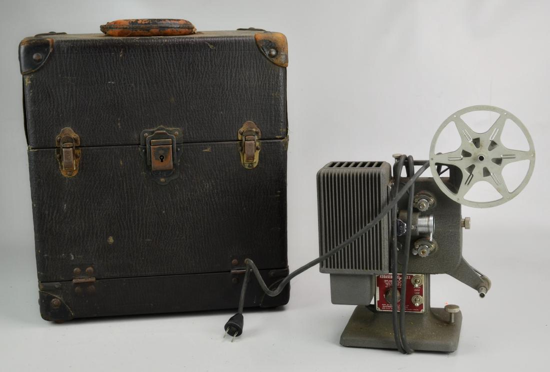 (2) Projectors: Kodak Kodascope Eight-33 Vintage 8MM Movie Projector (10-1/2" l x 6" w x 12-3/4" h), Bell and Howell Filmo Model 57 Projector with Box (Box Measures 14-1/4" x 9" w x 16" h)