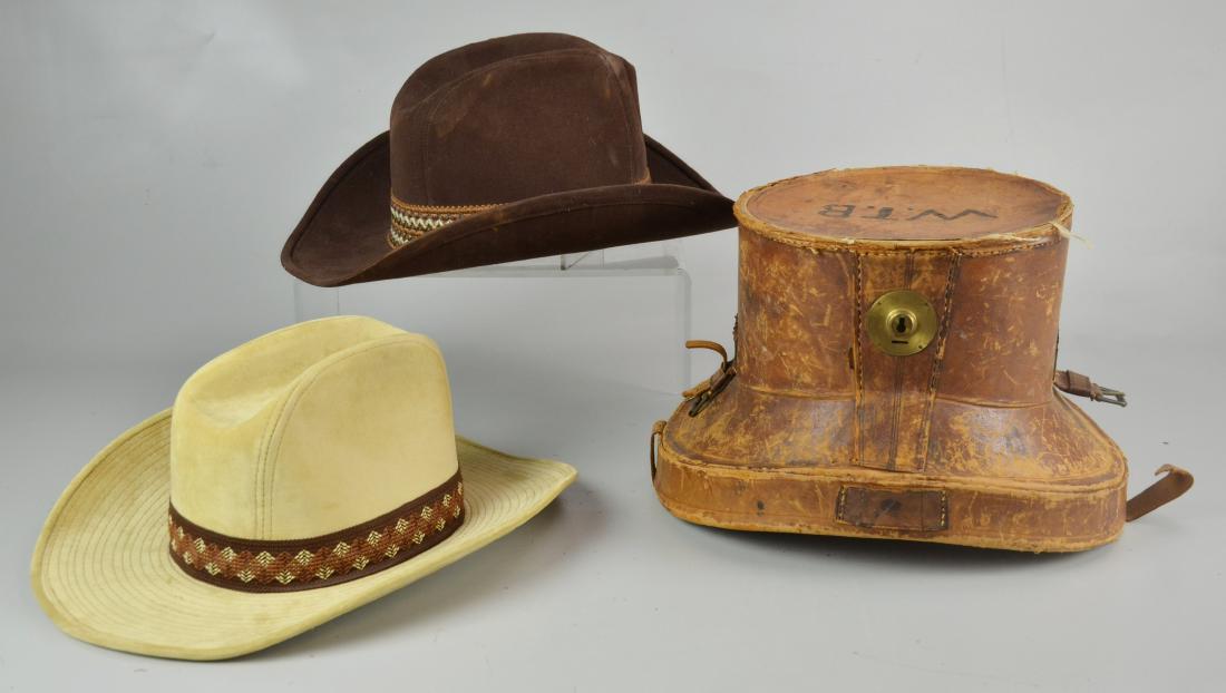 English Antique Leather Hat Box: Antique leather hat box with striped lined silk interior. Lot also includes (2) 1960's suede hats with woven band size 7 1/4 and 71/6