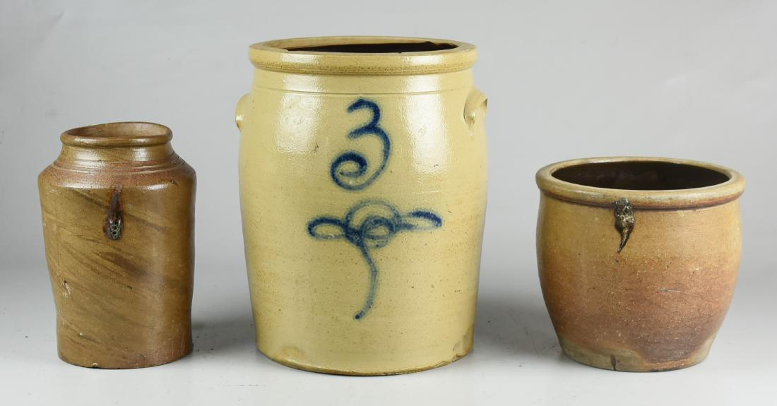(3) Pcs. Stoneware: (3) Pcs. stoneware c/o 3-gallon cobalt decorated ear handled crock with rim chips, canning jar with incised rings at rim (rim chip and turkey droppings), and storage crock with spider to base, 12" h x