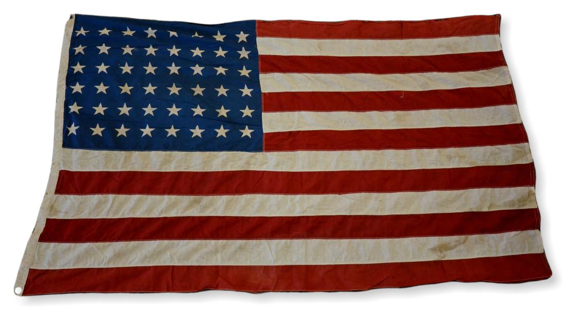 48-Star Cloth Flag: 48-Star cloth flag, sewn stripes, printed stars, 44" x 68", some holes & wear