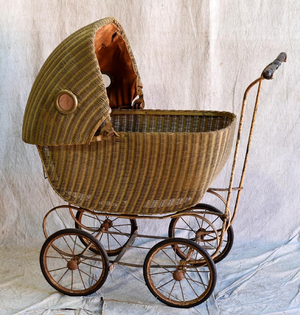 Antique Wicker Pram: Antique wicker pram, damage to interior fabric, 34"h x 32" long