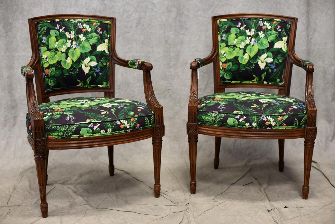 Louis XVI style walnut upholstered armchairs: Louis XVI style walnut upholstered armchairs, walnut finish, floral and leaf decorated upholstery, scrolled arms, acanthus leaf decoration over rosettes over reeded tapered legs, 33-3/4" h, seat heigh