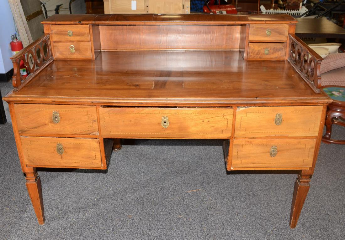 Mahogany French style executive desk: Mahogany French style executive desk, inlaid drawer fronts, and side panels, one drawer flanked by two drawers on each side, 39" h x 52" w x 32" d