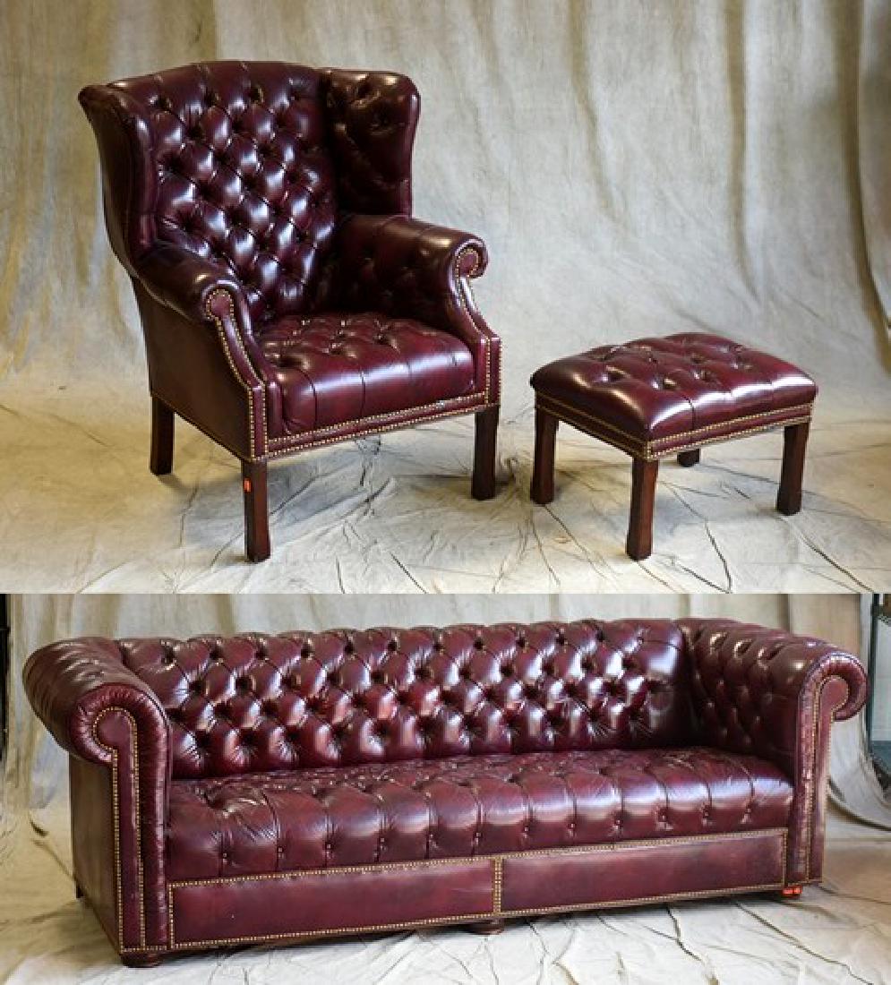 Red leather Chesterfield sofa, Red leather Chippendale: Burgundy leather Chesterfield sofa, Chippendale style wing chair w/ stool, sofa missing 2 buttons in seat on right side, sofa 30" h x 90" w x 36" d, sofa Missing buttons, right hand side of seat with