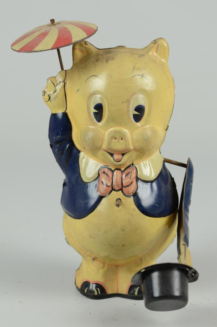 Porky Pig Tin Litho Toy: Porky Pig with umbrella & top hat tin litho wind-up toy, 1939, Leon Schlesinger, appears overwound, 8" h