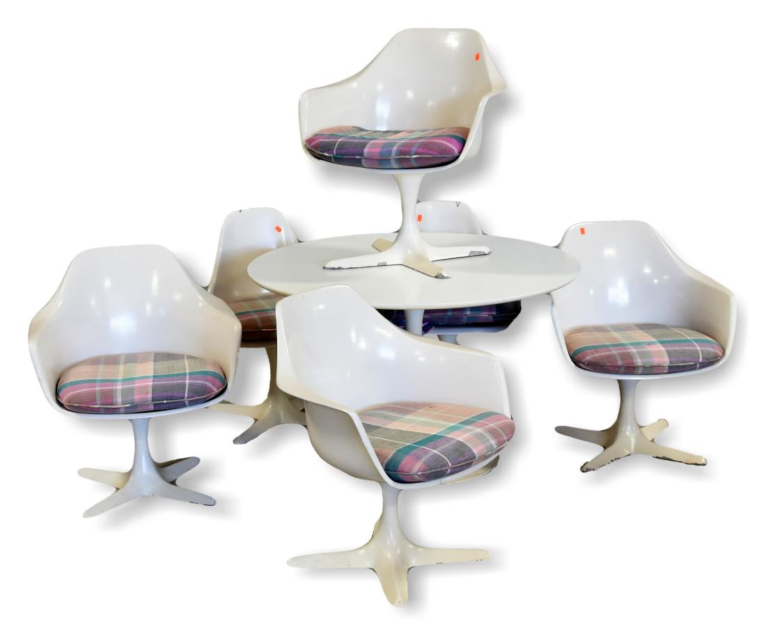 (7) pc Burke Inc Tulip style dining set: (7) pc Burke Inc Tulip style dining set, (6) chairs in the tulip style in white molded plastic, each piece on four leg star pedestal base, removable striped cushions, table with round top on pedestal