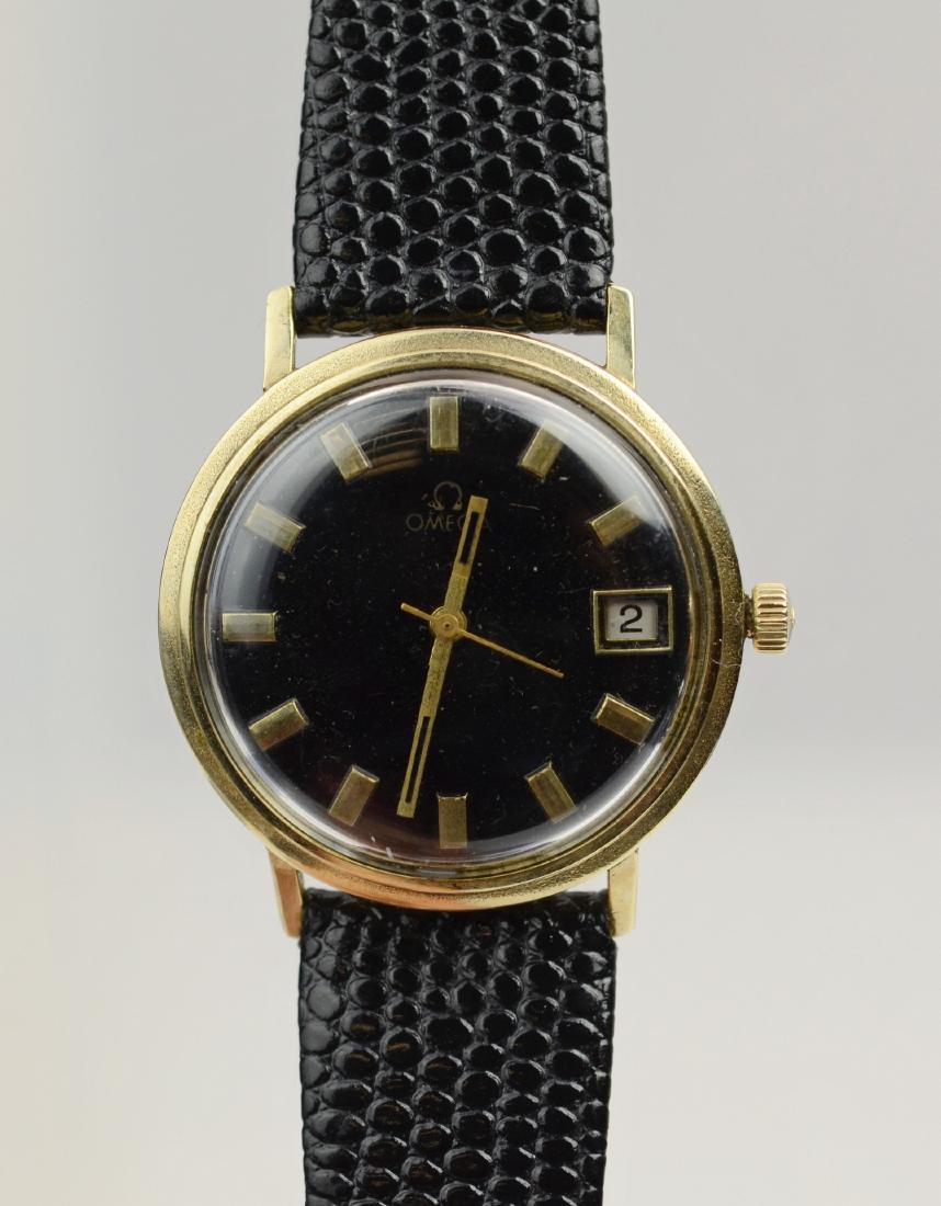 Omega 14K YG wrist watch: Omega 14K YG wrist watch, black date dial, 33 mm case, some scratches to back of case, leather band