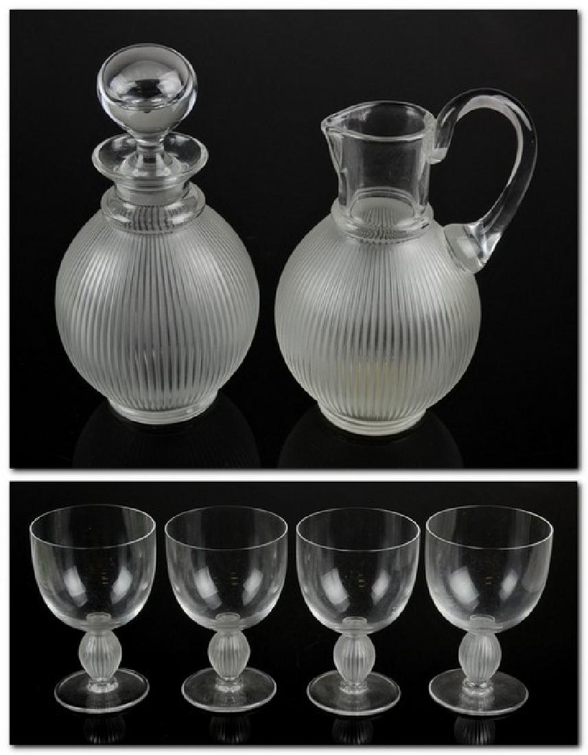 (6) Pcs Lalique Crystal Langeais: (6) Pieces Lalique crystal, Langeais pattern, frosted ribbed body, signed "Lalique France", c/o decanter, pitcher, (4) wine goblets, tallest 9-3/4'' h