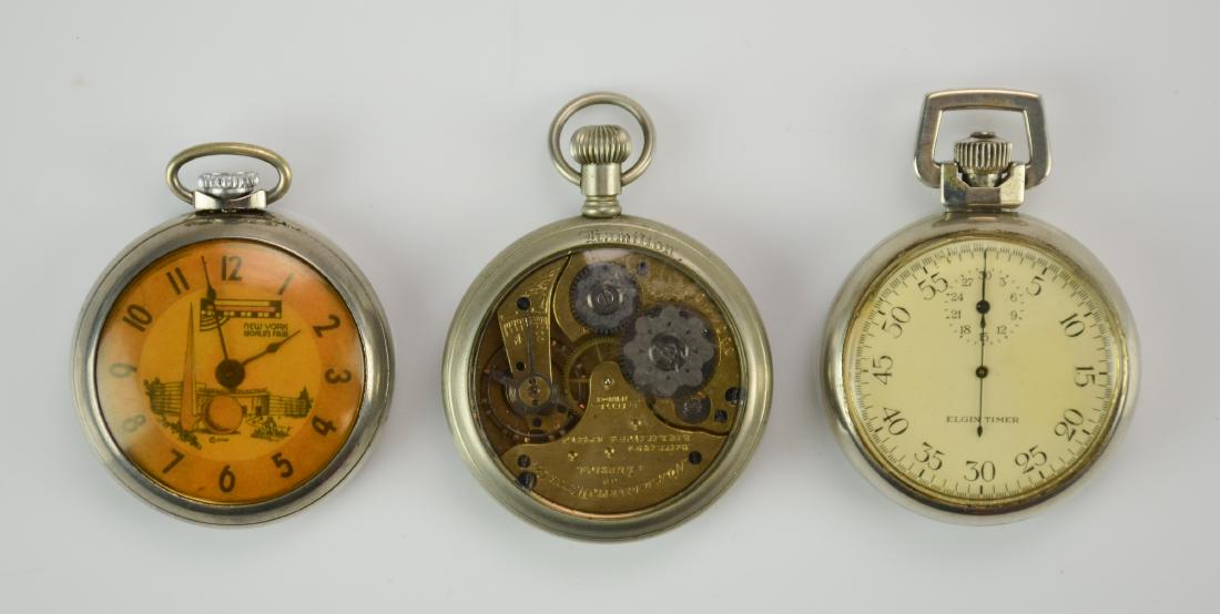 (3) pocket watches, Worlds Fair, Timer, Non-Magnetic: Ingraham New York World's Fair pocket watch, winds, tries to run; Elgin Timer stopwatch, working; Non-Magnetic Watch Co OF pocket watch in Hamilton display back case, running.