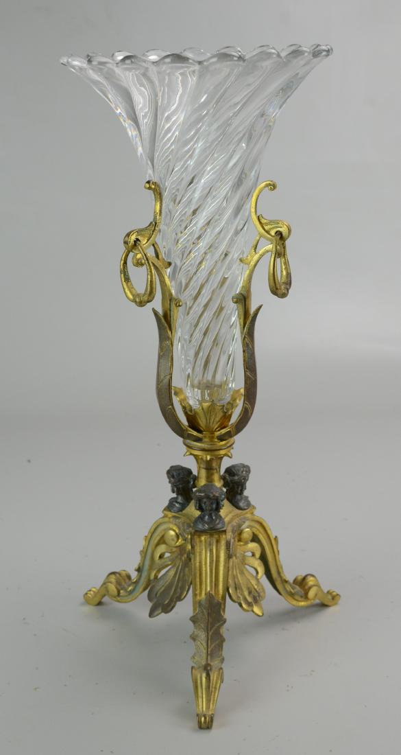 Gilt Metal & Glass Trumpet Vase: Gilt metal & glass trumpet vase, metal tripod base with ladies heads holding swirled glass removable vase, 3 ring handles, 16-1/4" h x 6-3/4" dia
