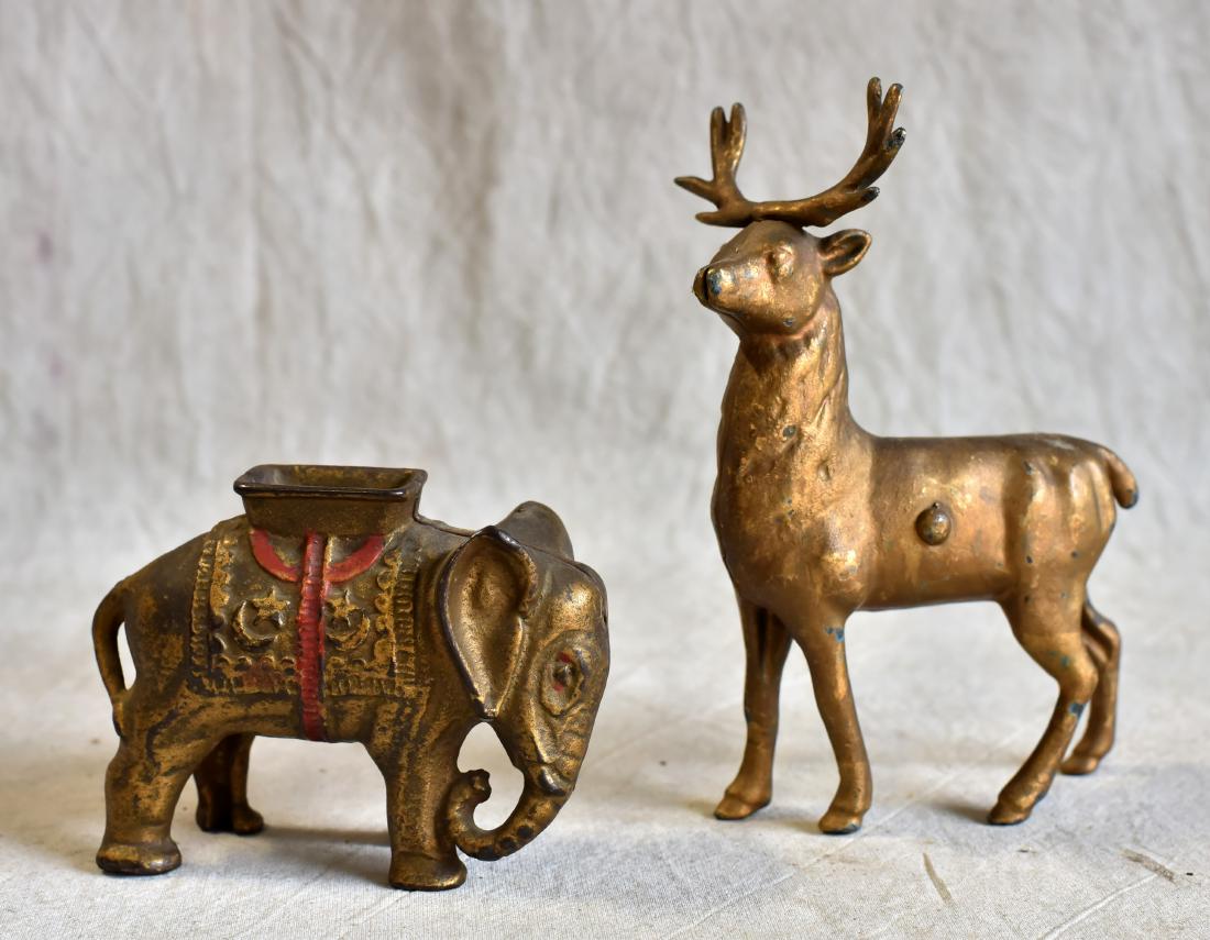 (2) Cast iron still banks, Elephant, Reindeer: (2) Cast iron still banks, Elephant with Howdah, small, 3" h, Small Reindeer, 6-1/4" h, both AC Williams or Arcade