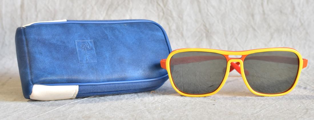 Vintage Bausch and Lomb Ray Ban Stateside Glasses: Vintage Ray Ban Stateside glasses with original felt lined case and dust towel. Glasses have polarized lenses with metallic coating and are encased in a red and yellow body.