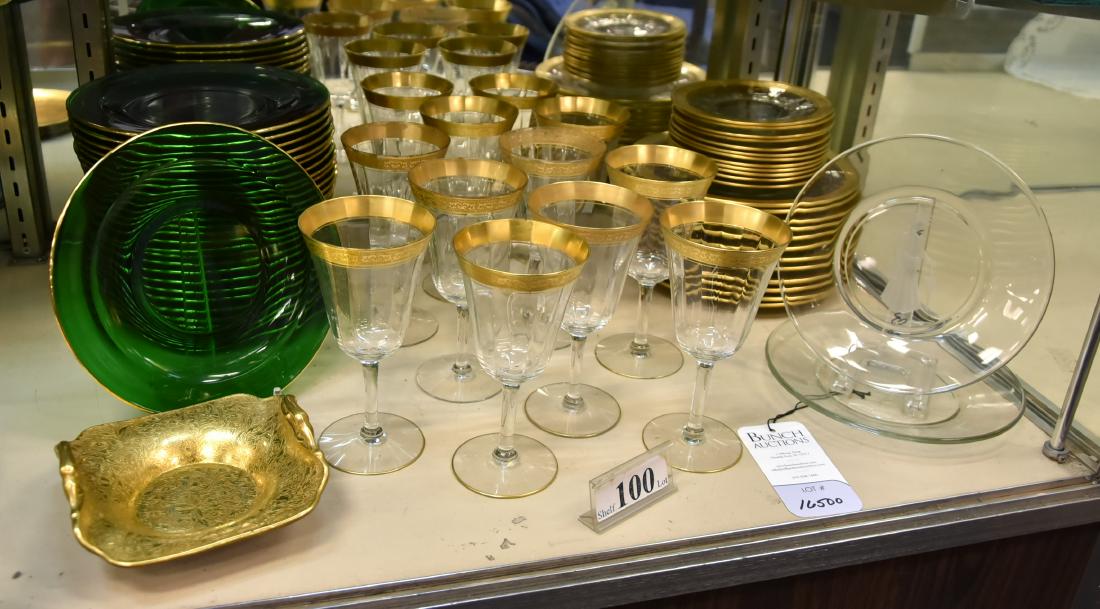 Shelf #100 -Glassware: Shelf # 100 - Gold trimmed glassware, c/o 12 luncheon plates, 12 saucers, 12 wine goblets, 26 green plates, 2 etched clear plates, tidbit