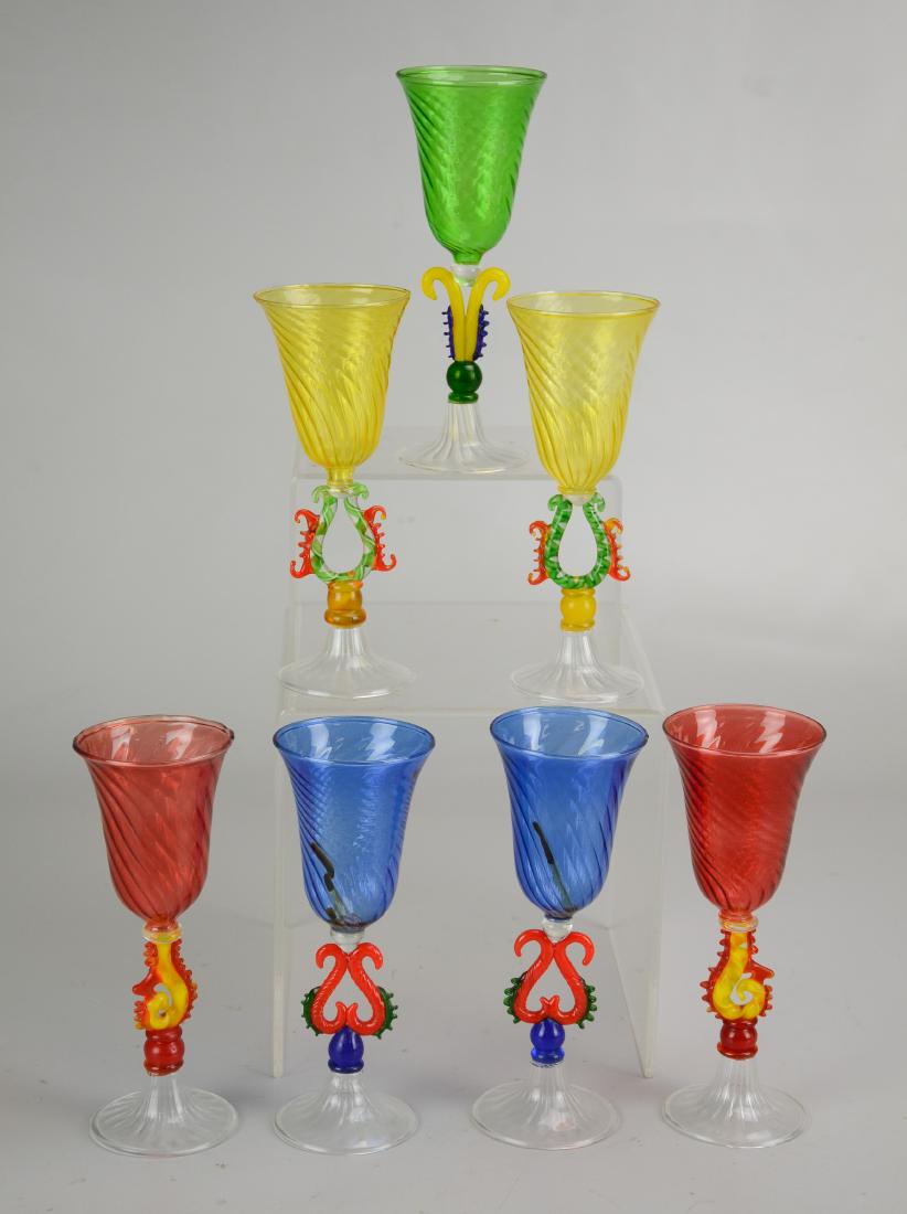(7) Venetian Art Glass Stems: (7) Venetian colorful Art Glass wine / aperitif glasses, figural stems, swirl bowls, clear fluted foot, 6" h