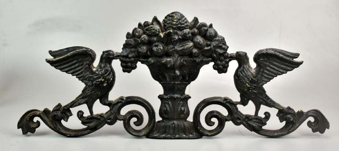 Cast Metal Wall Plaque: Black painted cast metal wall plaque, birds with urn of fruit, 30-1/2' x 12-1/4" h, some paint wear
