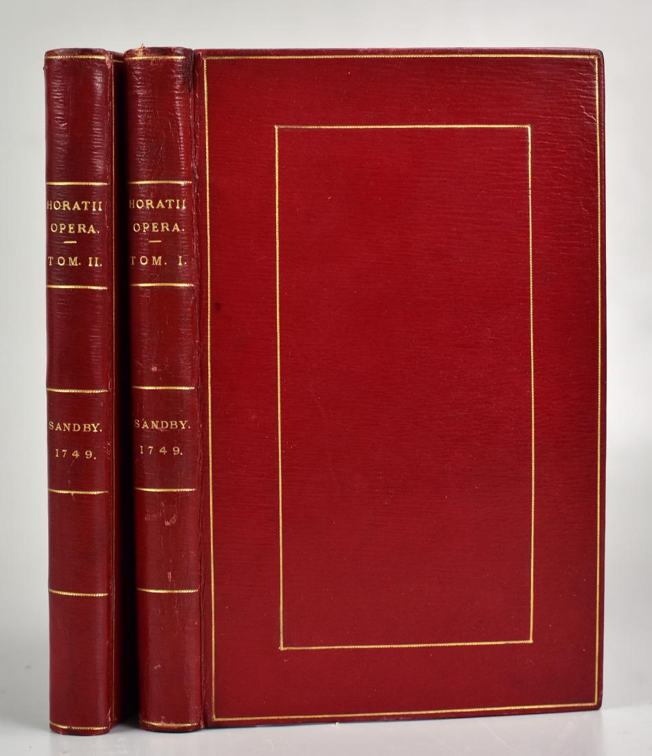 Horace, "Quinti Horatii Flacci Opera": Horace, "Quinti Horatii Flacci Opera" (London, G Sandby 1749); 2 vols in 8vo; 19th-cent gilt straight-grained red morocco; Near-perfect set of this finely-illustrated classic, 35 engraved plates; ESTC