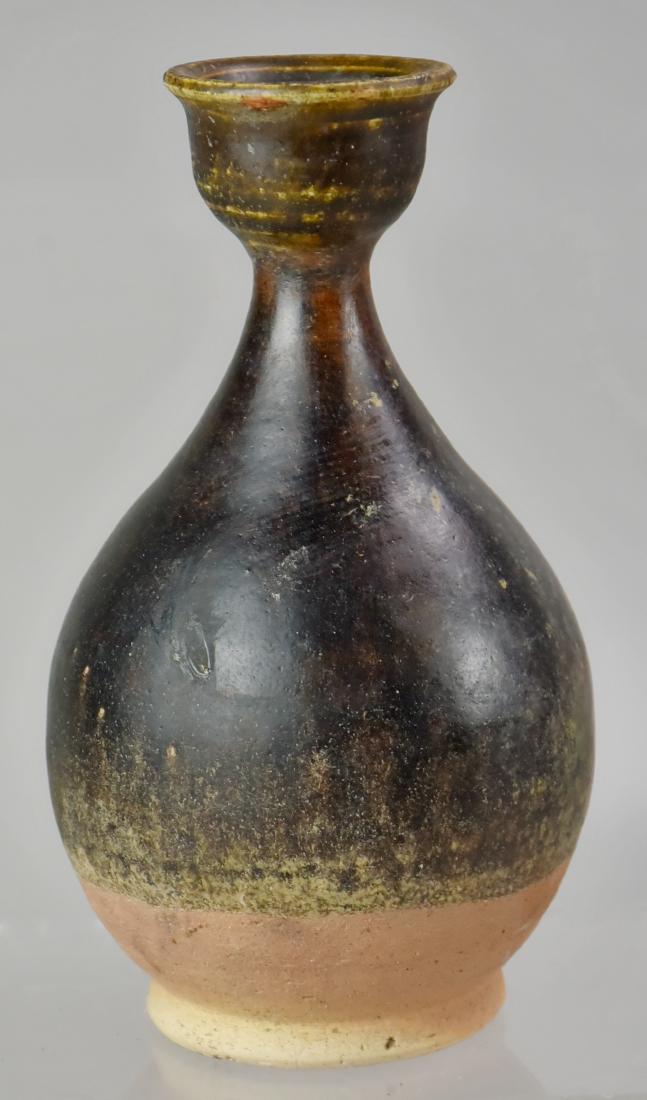 Thai Stoneware Pear Shaped Bottle: A Dark Brown Glazed Thai Stoneware Pear Shaped Bottle; 7-1/2" h
