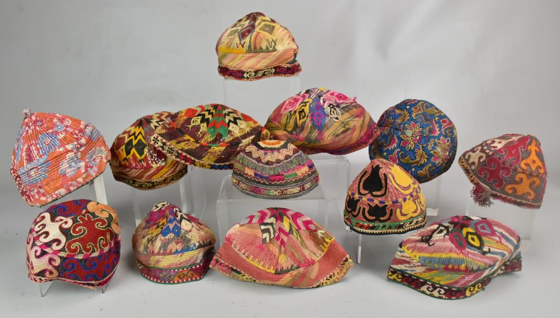 (13) Embroidered Hats: A collection of (13) silk embroidered hats, Uzbekistan, Central Asia