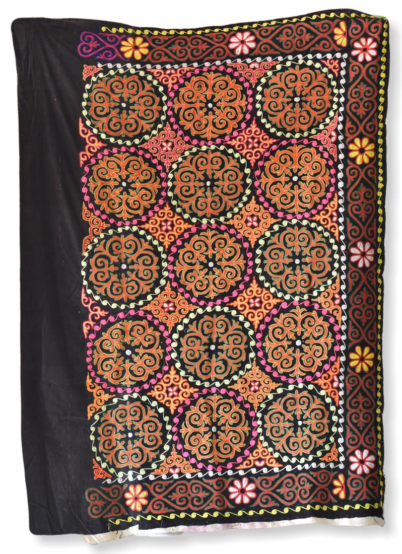 Embroidered Yurt Hanging with Black Ground: A finely embroidered silk yurt hanging with black ground, decorated with a large central panel of floral medallions, surrounded on three sides by a narrow floral band of similar motif, Central Asia. S