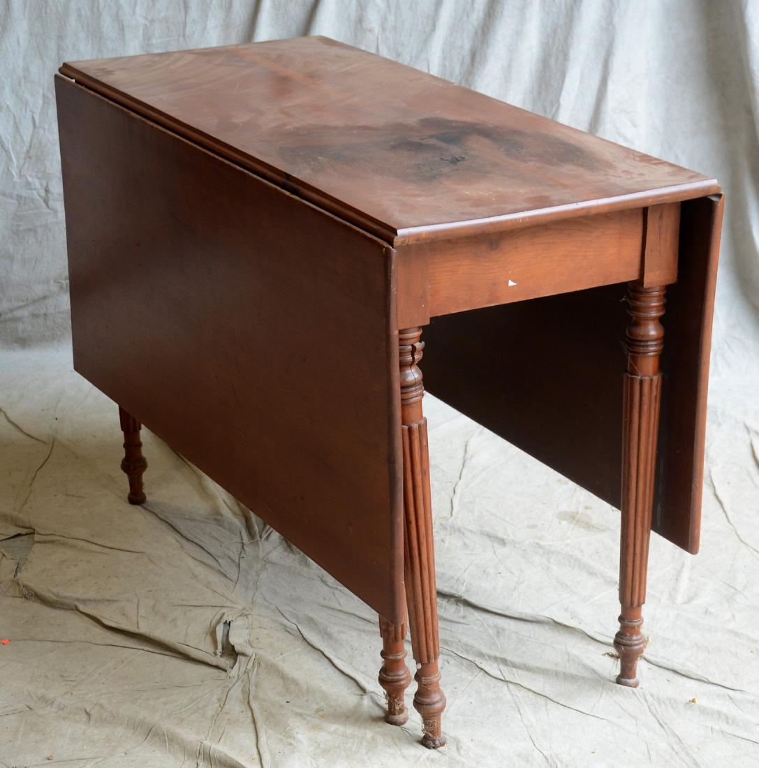 Mahogany Sheraton drop leaf table: Mahogany Sheraton drop leaf table, c 1810, reeded and tapered legs, 29"h x 43"w x 18"d, two 19-1/4"w drop leaves, damage to one leg