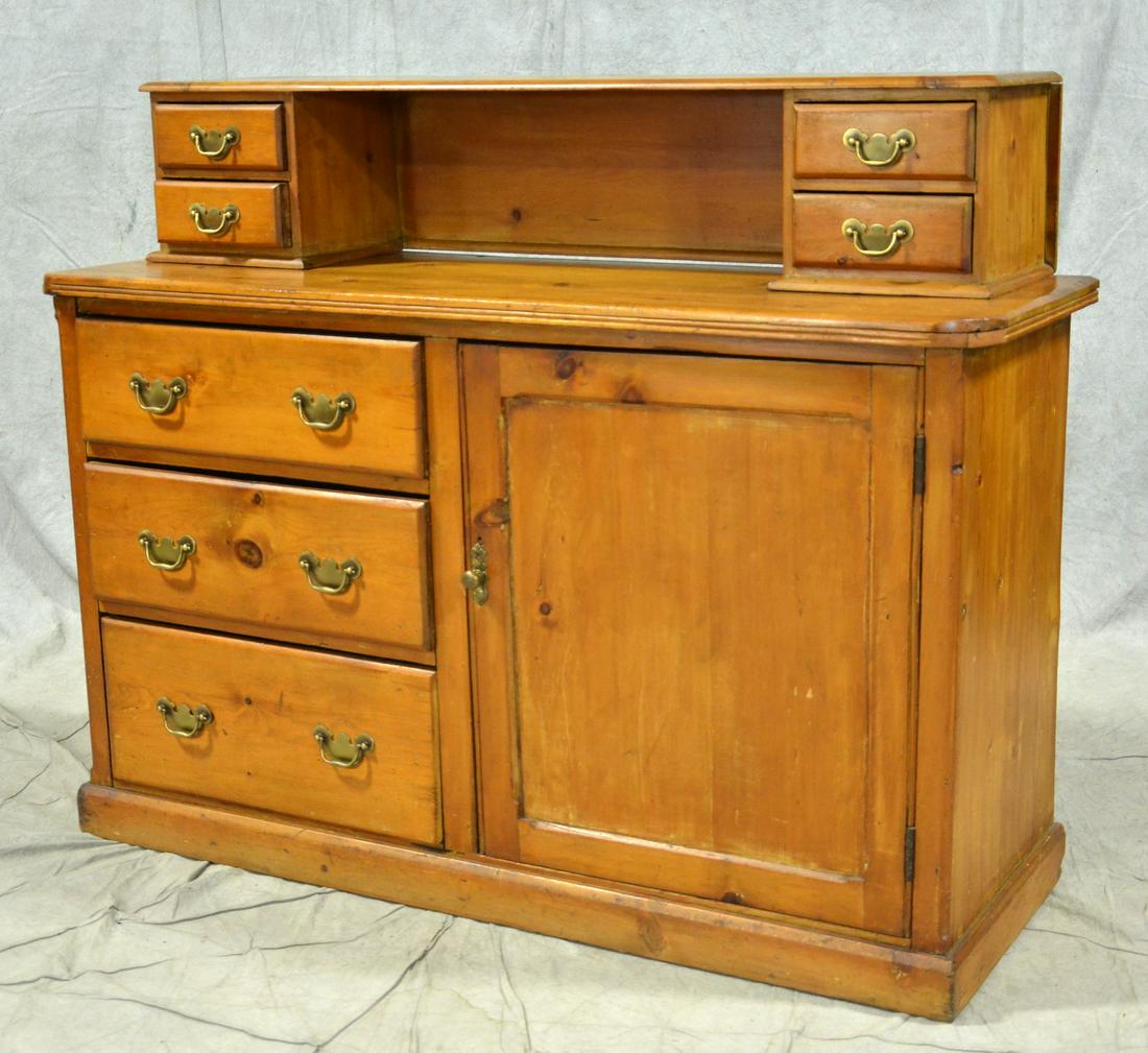 Primitive Pine Sideboard, American, 19th c: Primitive Pine Sideboard, American, 19th c, with raised top having two small drawers to each side. Thick molded top edge over lower case with cabinet on right and three drawers on left, Height 43", wi