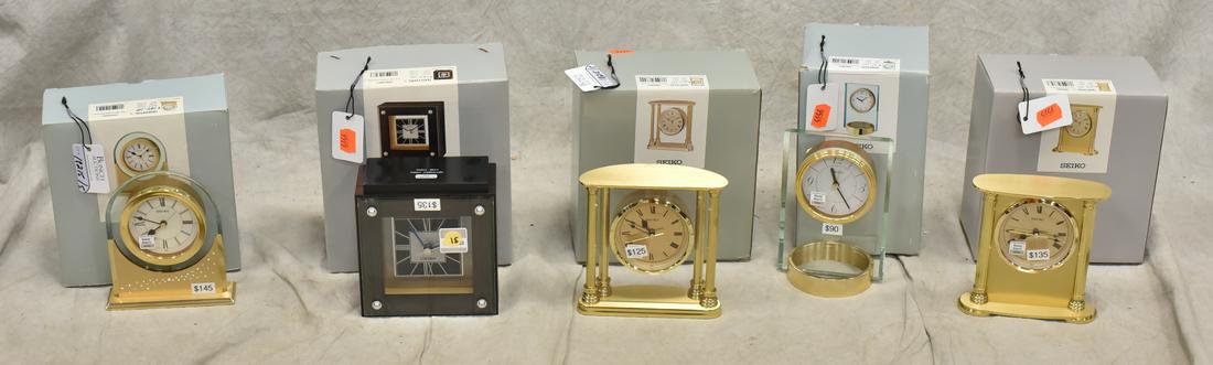 (5) Seiko Desk Clocks: (5) Seiko desk clocks, battery operated, c/o #QHE102GL, #QHE047GL, #QXG1216BL, #QHE101GL, #QHE054GL, largest 5-1/4" h x 5" w, new in original boxes, NOS