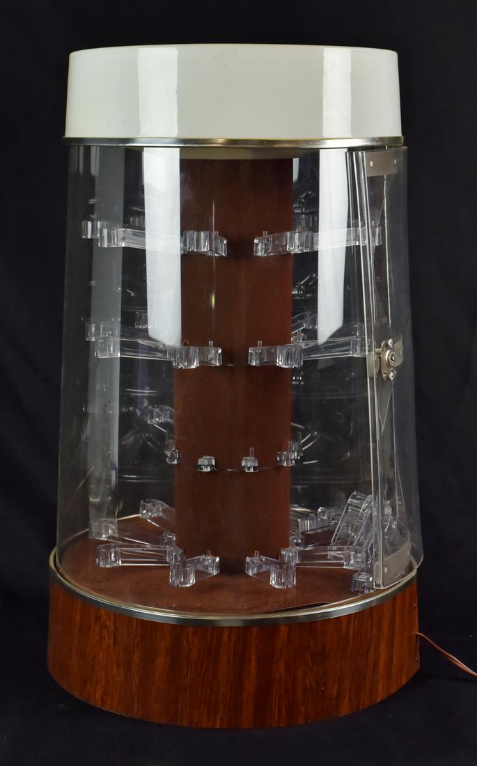 Lighted, Rotating Jewelry Display Case: Lighted, Rotating Jewelry Display Case with "The Jewelry Collection" In Gold Lettering on Front Manufactured by Mechtronics Corporation, (11" Dia x 21-1/2" h), (Working at Time of Cataloging, Some Sec