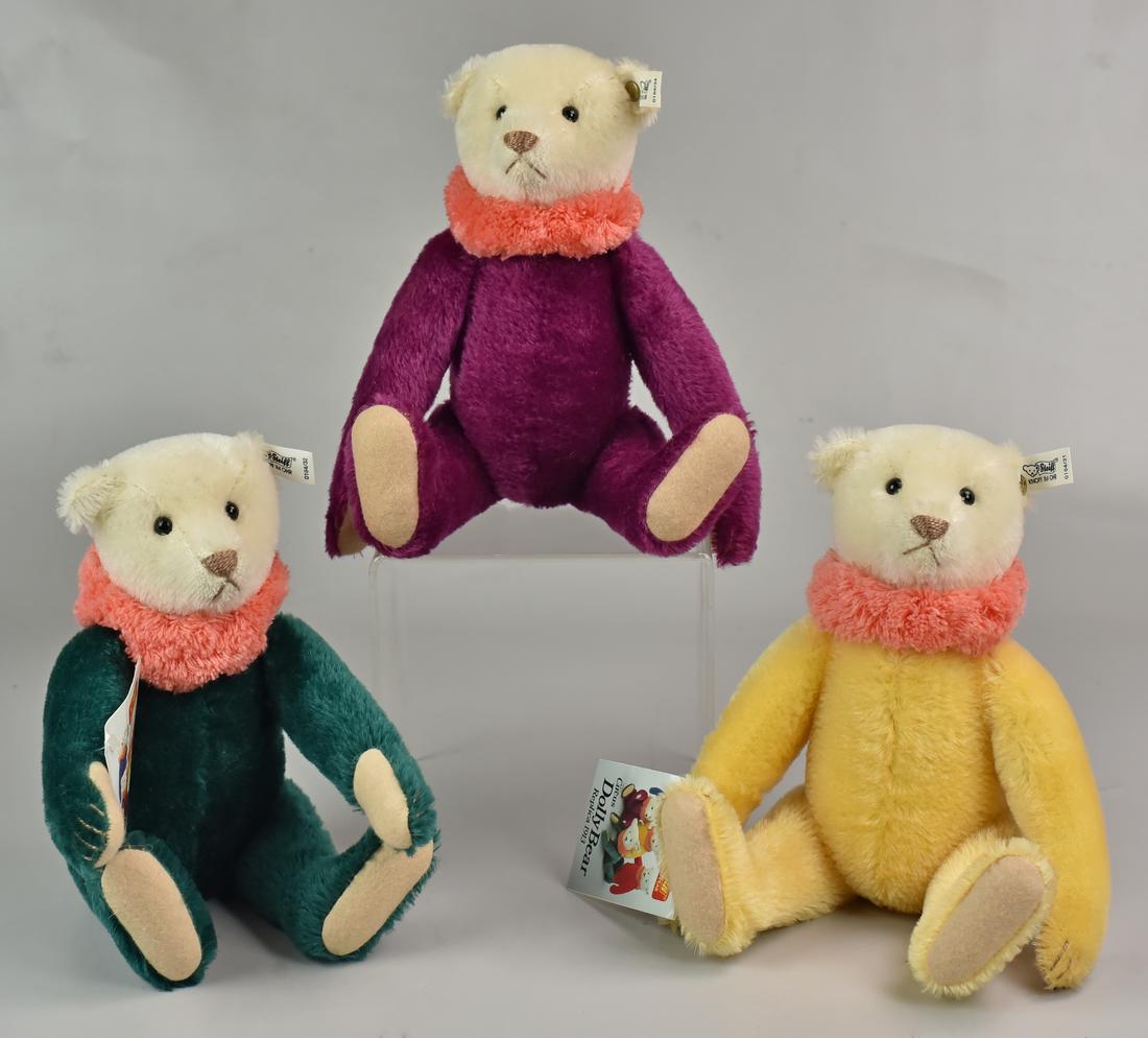 (3) Steiff Circus Dolly Bear Replicas: (3) Steiff Circus Dolly Bear replicas, green, purple, & yellow, 12" h, each with ear button & tag, 2 with paper hang tag