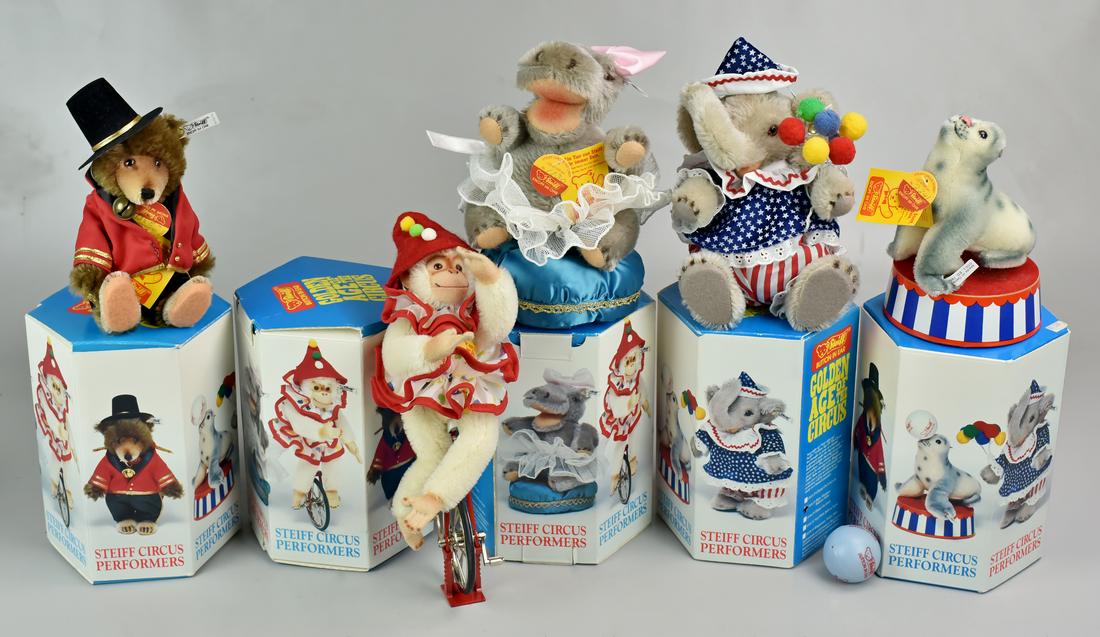 (5) Steiff Circus Performers: (5) Steiff Circus Performers, c/o Chimp on unicycle, Baby Elephant balloon seller, Hippo fat lady, Seal with ball on stand, Ringmaster teddy bear, tallest 8", each with ear button & tag, original boxe