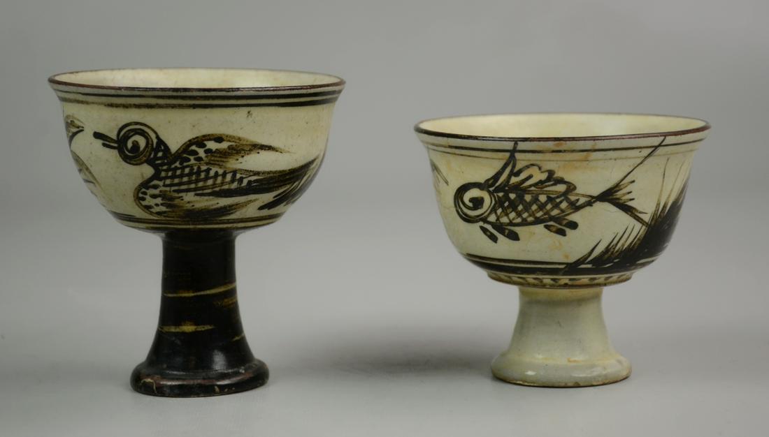 (2) Chinese Cizhou Stem Cups: (2) Chinese cizhou stem cups, one with fish, one with bird, tallest 3-7/8"